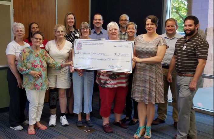 Friends of the Library presenting check to the Roseville Public Library